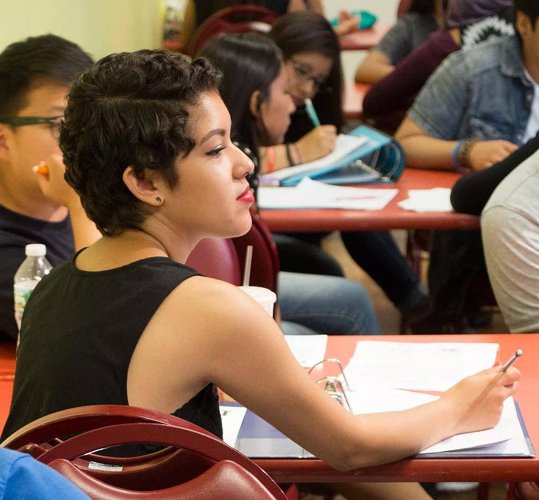 High school student listens to a lecture in the classroom