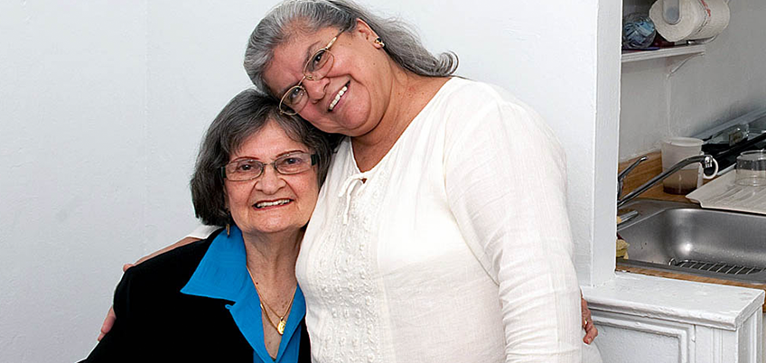 Care at Home Two women hugging while posing for a photo