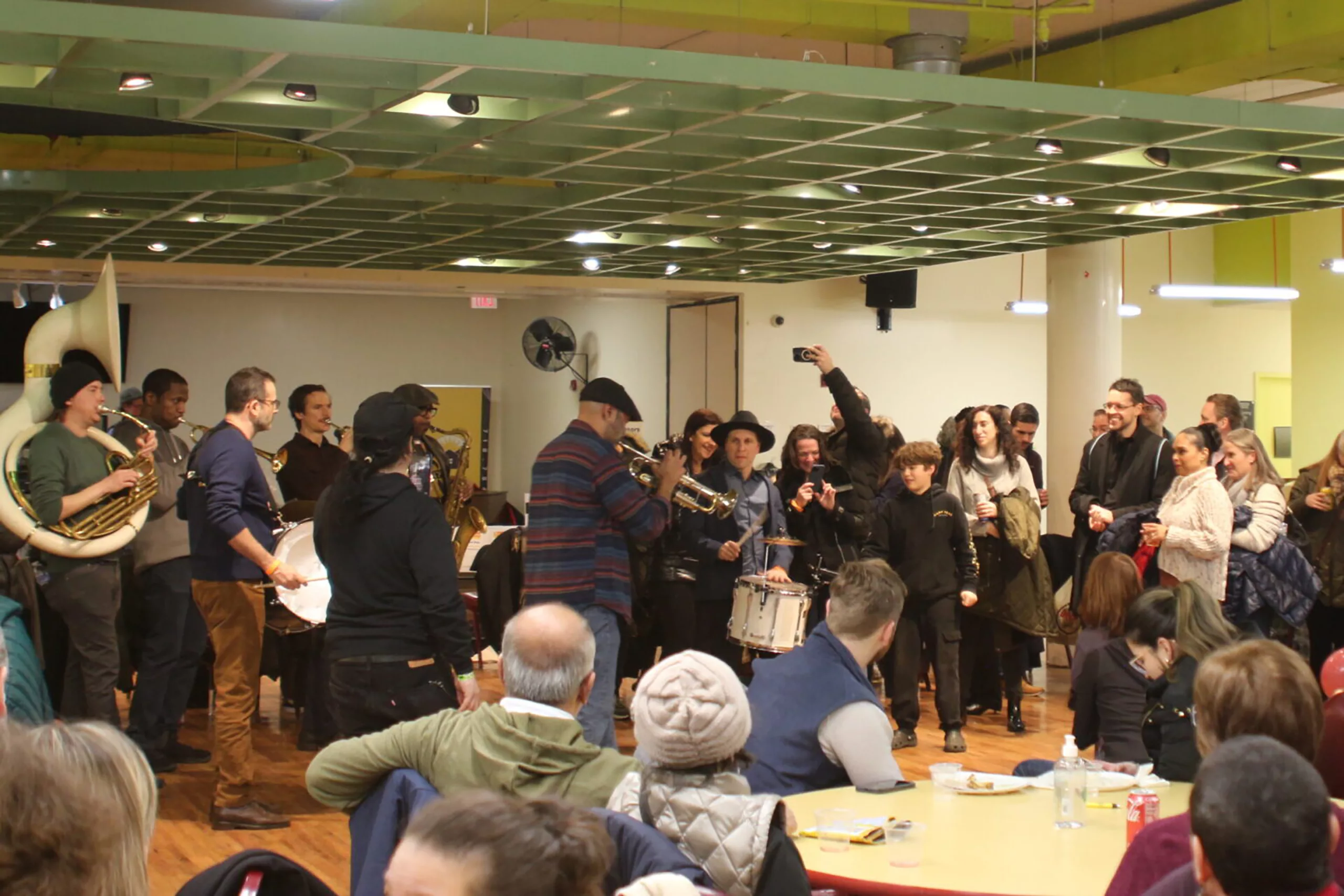 Photo of a brass band performing for guests at a benefit event in Sunnyside, Queens.